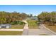 An aerial view of the property, featuring a long driveway and a well-maintained lawn at 2600 Robie Ave, Mount Dora, FL 32757