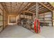 Open barn interior showcases ample storage, shelving, and natural light, ideal for projects at 2600 Robie Ave, Mount Dora, FL 32757