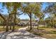 Stunning home on a large lot featuring a long driveway, mature trees, and a meticulously maintained lawn at 2600 Robie Ave, Mount Dora, FL 32757