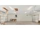 Spacious three car garage with high ceilings and attic access at 2600 Robie Ave, Mount Dora, FL 32757
