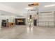 Spacious four car garage with high ceilings, storage racks, and work area at 2600 Robie Ave, Mount Dora, FL 32757