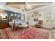 Charming main bedroom features a wood ceiling and accent wall, creating a cozy retreat at 2600 Robie Ave, Mount Dora, FL 32757