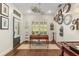 Bright office with dark wood floors, white walls, and a collection of unique clocks at 2600 Robie Ave, Mount Dora, FL 32757