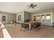 Covered patio area with dining set and outdoor seating at 2600 Robie Ave, Mount Dora, FL 32757