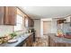 Galley-style kitchen featuring wood cabinets, black appliances, and laminate countertops at 0 Allison Ave, Lake Wales, FL 33859