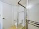 Bathroom displaying a frosted-glass shower enclosure and door to the commode at 1009 Royal Oak Blvd, Leesburg, FL 34748