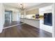 View of the dining space and kitchen, featuring modern appliances, wood countertops, and tiled floors at 1009 Royal Oak Blvd, Leesburg, FL 34748