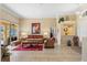 Inviting living room with tile floors, neutral color scheme, and access to outdoor living area at 10846 Point Nellie Dr, Clermont, FL 34711