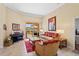 Elegant living room with comfortable seating and sliding glass doors to the outdoor space at 10846 Point Nellie Dr, Clermont, FL 34711