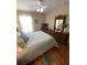 Comfortable main bedroom featuring hardwood floors and a full dresser with large mirror at 10846 Point Nellie Dr, Clermont, FL 34711