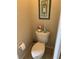 Toilet in the bathroom, featuring a decorative shelf above at 10846 Point Nellie Dr, Clermont, FL 34711