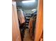 Walk-in closet filled with clothing and shoes, maximizing storage and organization at 10846 Point Nellie Dr, Clermont, FL 34711