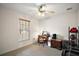 Bedroom with a ceiling fan, natural light from the window, and a desk at 109 Pecan Pass, Ocala, FL 34472