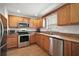 Beautiful kitchen featuring stainless steel appliances and elegant granite countertops at 109 Pecan Pass, Ocala, FL 34472