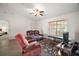 Comfortable living room with a ceiling fan, neutral walls, and lots of natural light at 109 Pecan Pass, Ocala, FL 34472