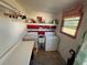 This is a utilitarian laundry room with washer, dryer, and sink at 1127 Belmont Cir, Tavares, FL 32778