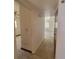 Hallway featuring tile flooring and leading to other areas of the home at 115 N Galena Ave, Minneola, FL 34715