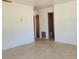 Living room space showcasing tile flooring and access to other rooms at 115 N Galena Ave, Minneola, FL 34715