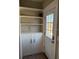 Mud room with built-in shelves, cabinets and a door leading outside at 1326 East Ave, Clermont, FL 34711