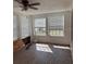 Empty room featuring multiple windows and hardwood floors, awaiting customization and finishing touches at 1326 East Ave, Clermont, FL 34711