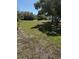 A grassy lot that is partially shaded by trees at 1326 East Ave, Clermont, FL 34711