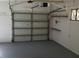 Clean garage with automatic door and ample storage space at 1391 E Crooked Lake Dr, Eustis, FL 32726