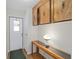 Inviting entryway with wooden console table, cabinetry, and laminate flooring at 1501 W Schwartz Blvd, Lady Lake, FL 32159