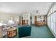 Spacious living room flowing into the kitchen and dining area at 1501 W Schwartz Blvd, Lady Lake, FL 32159