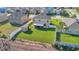 Overhead view showcasing the home's large backyard, complete with a shed and a screened-in porch at 16707 Broadford Ln, Clermont, FL 34714