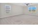 Bright and airy main bedroom with carpet and windows providing ample natural light at 16707 Broadford Ln, Clermont, FL 34714
