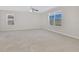 Spacious bedroom featuring neutral walls, carpet and large windows with lots of natural light at 16707 Broadford Ln, Clermont, FL 34714