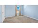 Bright bedroom features a window and neutral carpet, providing a blank canvas at 16707 Broadford Ln, Clermont, FL 34714