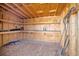 Interior view of a wooden storage shed, featuring shelves and ample storage space at 16707 Broadford Ln, Clermont, FL 34714