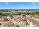 Extensive aerial view of home in a neighborhood close to green trees and water at 1685 Garcia Ct, The Villages, FL 32159