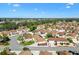 Beautiful aerial view of a home in a well-maintained neighborhood with green landscaping at 1685 Garcia Ct, The Villages, FL 32159