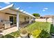 Covered patio with ceiling fan and outdoor dining set, perfect for entertaining at 1685 Garcia Ct, The Villages, FL 32159