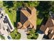 Aerial view of a single-Gathering home featuring a brown roof and a paver driveway at 17274 Se 85Th Willowick Cir, The Villages, FL 32162