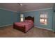 Cozy bedroom featuring a ceiling fan, a comfortable bed, and natural light from the windows at 17274 Se 85Th Willowick Cir, The Villages, FL 32162