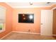 Bedroom showcasing a flat screen television installed above electrical outlets at 17274 Se 85Th Willowick Cir, The Villages, FL 32162