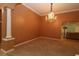 Cozy dining room featuring an elegant chandelier and open access to the nearby living room and other spaces at 17274 Se 85Th Willowick Cir, The Villages, FL 32162