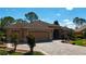 Inviting single-story home features brick paver driveway and well-maintained lawn in a quiet neighborhood at 17274 Se 85Th Willowick Cir, The Villages, FL 32162