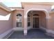 Welcoming front entrance with decorative glass door, sidelight windows, and brick-paved walkway at 17274 Se 85Th Willowick Cir, The Villages, FL 32162