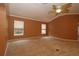 Comfortable living room features neutral carpet, abundant natural light, and ceiling fan at 17274 Se 85Th Willowick Cir, The Villages, FL 32162