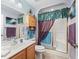 Bathroom with a tub/shower, toilet, vanity, and colorful decor at 17378 Se 110Th Ter, Summerfield, FL 34491