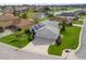 Exterior view of a home with a spacious two-car garage and manicured lawn, showcasing curb appeal at 17378 Se 110Th Ter, Summerfield, FL 34491