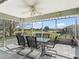 Enjoy the outdoors on this screened lanai with a view of the pond and surrounding community at 17378 Se 110Th Ter, Summerfield, FL 34491