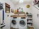 Functional laundry room equipped with modern washer and dryer units at 17378 Se 110Th Ter, Summerfield, FL 34491