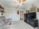 Relaxing living room with comfortable seating, television, and ample closet space at 17378 Se 110Th Ter, Summerfield, FL 34491