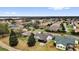 Aerial view of the residential community highlighting the lush landscape and cozy outdoor patios at 1755 Lakewood Dr, The Villages, FL 32162