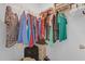 Walk-in closet with wire shelving and a variety of clothing items at 1755 Lakewood Dr, The Villages, FL 32162